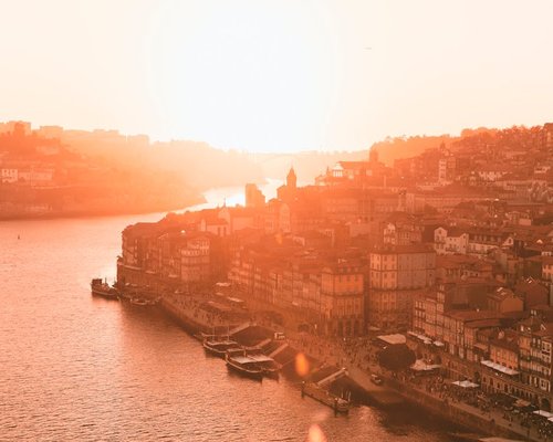 beautiful sunset view over the city of porto reflecting on the river